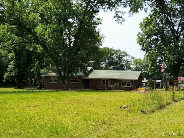 445 W Hickory Grove Rd, Lapine, AL 36046 - rear view of property with a lawn and metal roof