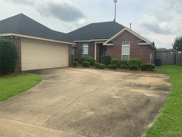2320 Halcyon Downs Loop, Montgomery, AL 36117 - view of front of property with brick siding, driveway, a shingled roof, and a garage