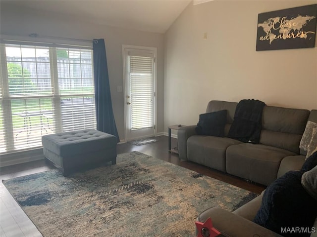 2320 Halcyon Downs Loop, Montgomery, AL 36117 - living area featuring vaulted ceiling, wood finished floors, and baseboards