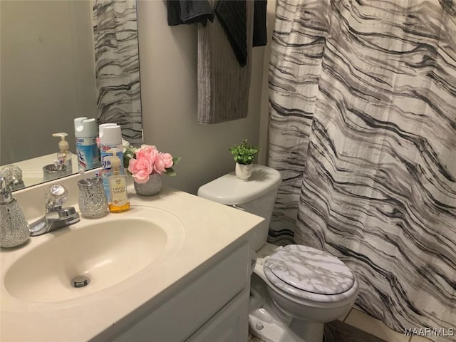 2320 Halcyon Downs Loop, Montgomery, AL 36117 - bathroom featuring vanity, toilet, and a shower with shower curtain