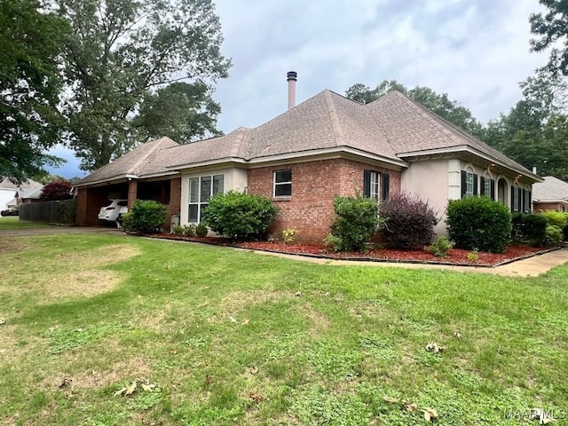 1915 Emerald Mountain Pkwy, Wetumpka, AL 36093 - view of side of property featuring brick siding, a lawn, and a shingled roof