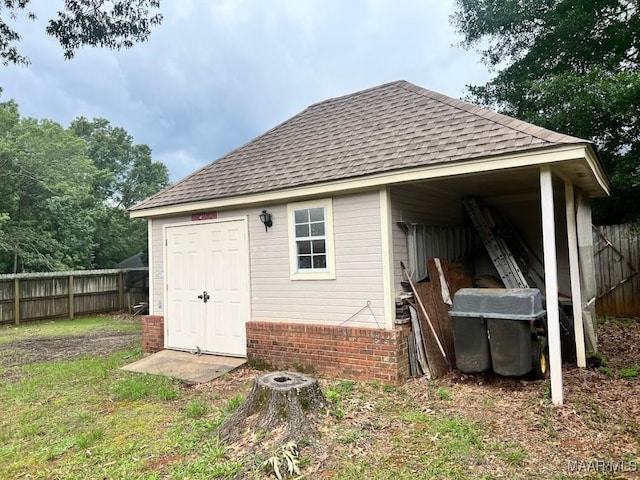 1915 Emerald Mountain Pkwy, Wetumpka, AL 36093 - back of house with roof with shingles, brick siding, and an outbuilding