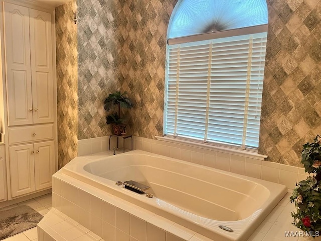 1915 Emerald Mountain Pkwy, Wetumpka, AL 36093 - full bath featuring a garden tub, tile patterned floors, and tile walls