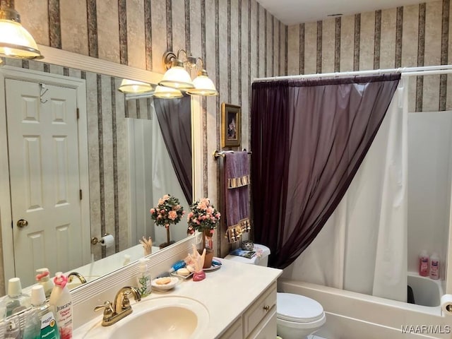 1915 Emerald Mountain Pkwy, Wetumpka, AL 36093 - bathroom with wallpapered walls, vanity, toilet, and shower / bath combination with curtain