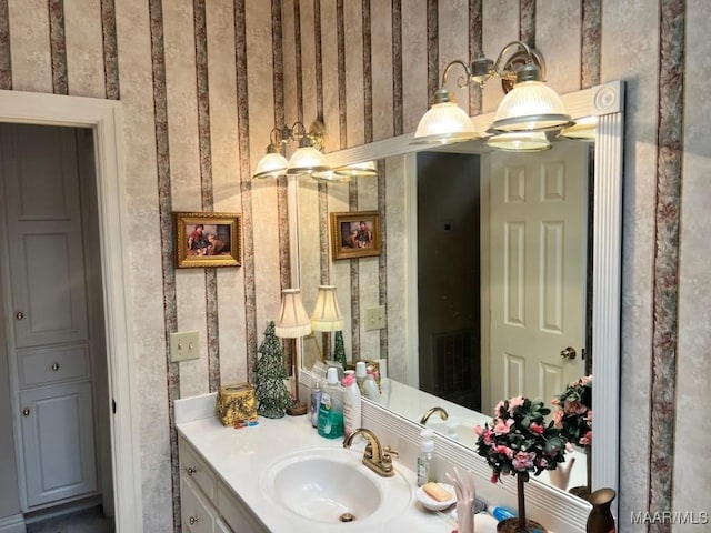1915 Emerald Mountain Pkwy, Wetumpka, AL 36093 - bathroom with wallpapered walls and vanity