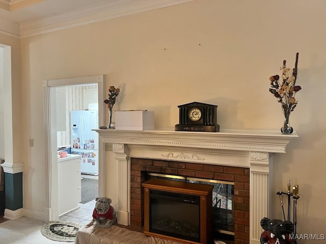 1915 Emerald Mountain Pkwy, Wetumpka, AL 36093 - detailed view of a brick fireplace, white refrigerator with ice dispenser, carpet, ornamental molding, and baseboards