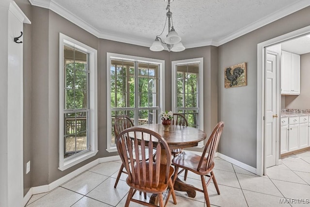 594 Lewis Rd, Deatsville, AL 36022 - dining room featuring a chandelier, plenty of natural light, light tile patterned flooring, crown molding, and baseboards