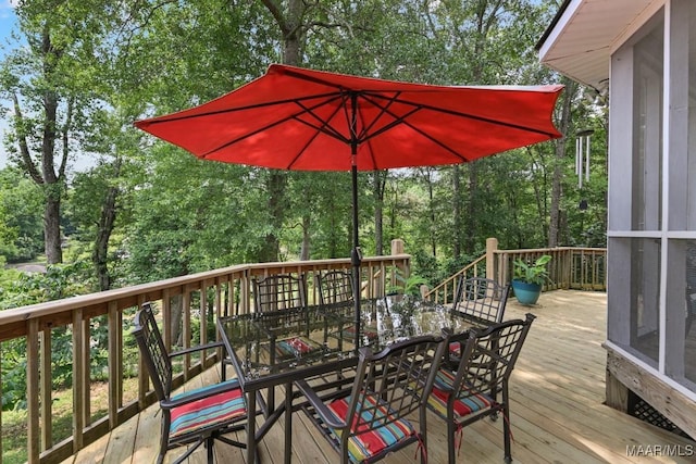 594 Lewis Rd, Deatsville, AL 36022 - deck featuring outdoor dining area and view of scattered trees