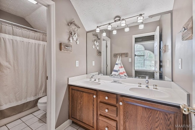 594 Lewis Rd, Deatsville, AL 36022 - bathroom with tile patterned floors, double vanity, toilet, a textured ceiling, and a shower with curtain