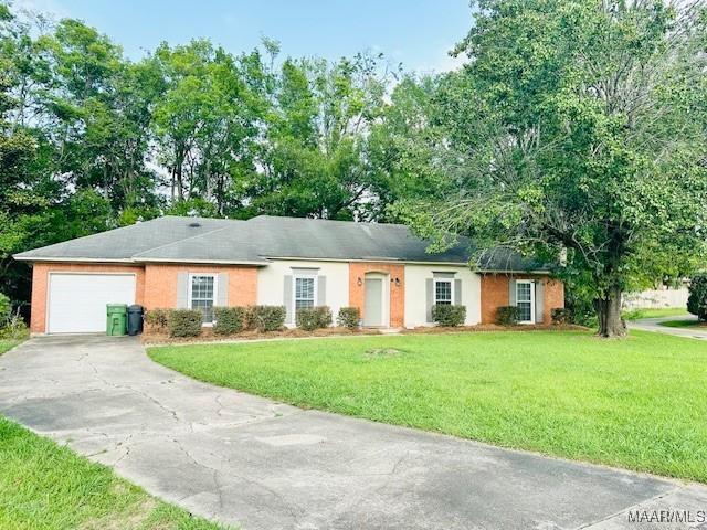 6118 Helga Pl, Montgomery, AL 36117 - single story home featuring a garage, driveway, and a front lawn