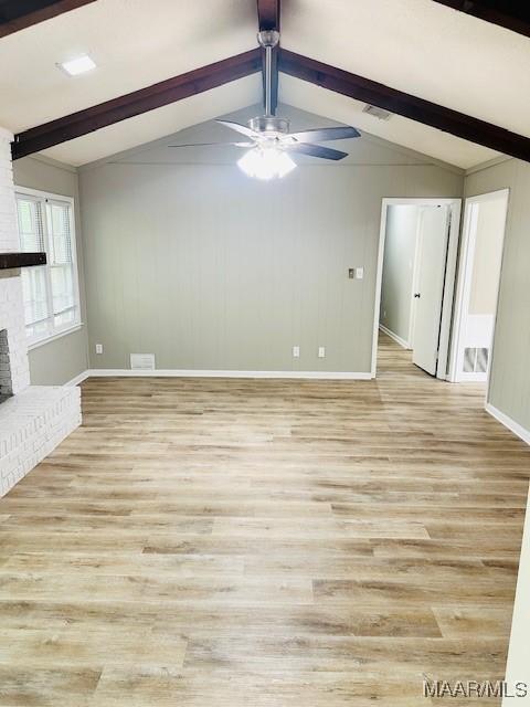 6118 Helga Pl, Montgomery, AL 36117 - unfurnished living room with baseboards, a fireplace, a ceiling fan, and light wood-style floors