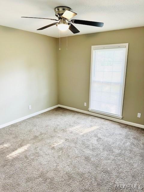 6118 Helga Pl, Montgomery, AL 36117 - spare room featuring a ceiling fan, carpet flooring, and baseboards