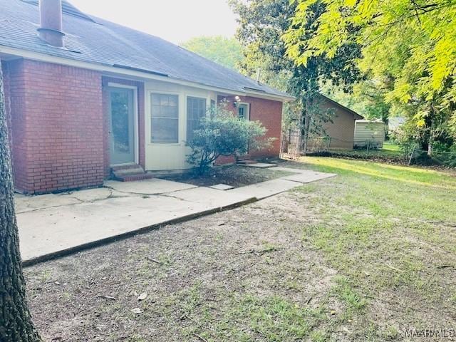 6118 Helga Pl, Montgomery, AL 36117 - view of green lawn featuring entry steps and a patio area