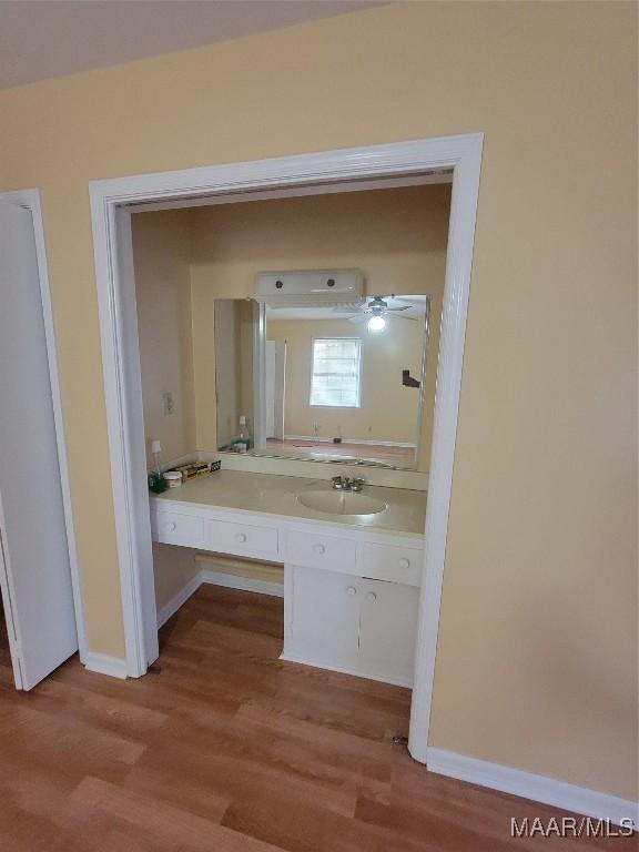 55 County Road 65th Rd, Valley Grande, AL 36701 - bathroom with wood finished floors, vanity, and baseboards