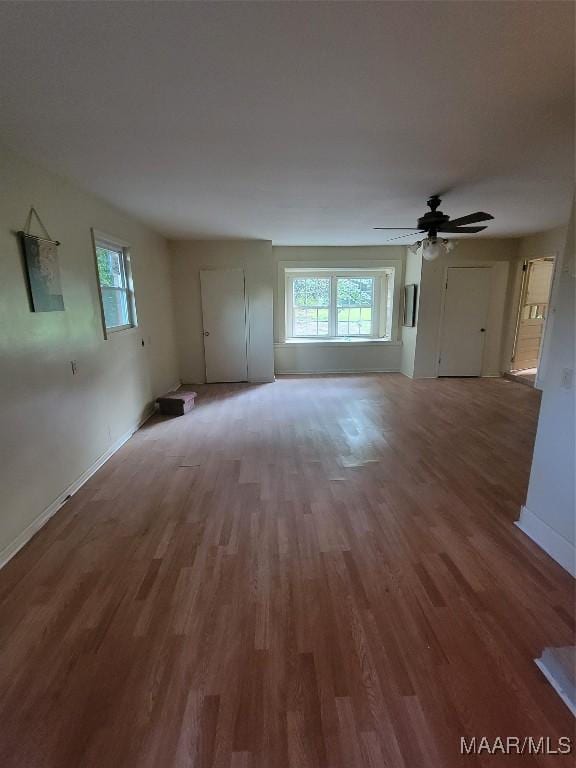 55 County Road 65th Rd, Valley Grande, AL 36701 - unfurnished living room with plenty of natural light, wood finished floors, baseboards, and ceiling fan