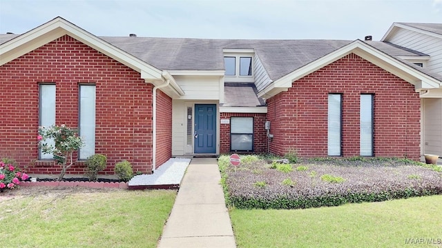 6616 Chaprice Ln, Montgomery, AL 36117 - view of front of property with brick siding, a front lawn, and a shingled roof