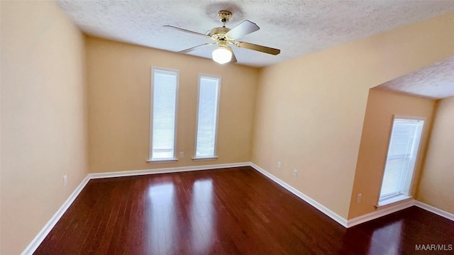 6616 Chaprice Ln, Montgomery, AL 36117 - unfurnished room featuring dark wood finished floors, baseboards, a textured ceiling, and ceiling fan