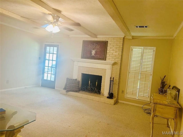 108 Shawnee Dr, Wetumpka, AL 36092 - unfurnished living room featuring beamed ceiling, carpet floors, ceiling fan, baseboards, and a brick fireplace