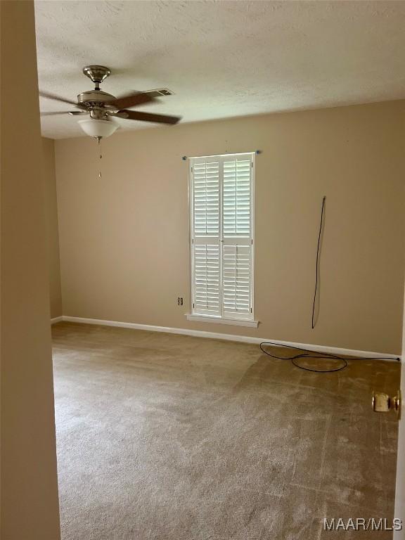 108 Shawnee Dr, Wetumpka, AL 36092 - carpeted empty room with ceiling fan, baseboards, and a textured ceiling