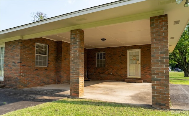 22 Daleview Cir, Sylacauga, AL 35150 - view of patio featuring a carport
