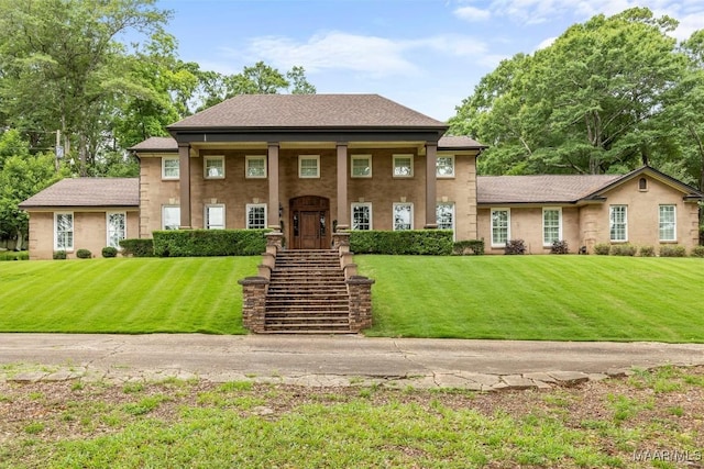 161 Watson Cir, Montgomery, AL 36109 - neoclassical home with a front yard and roof with shingles