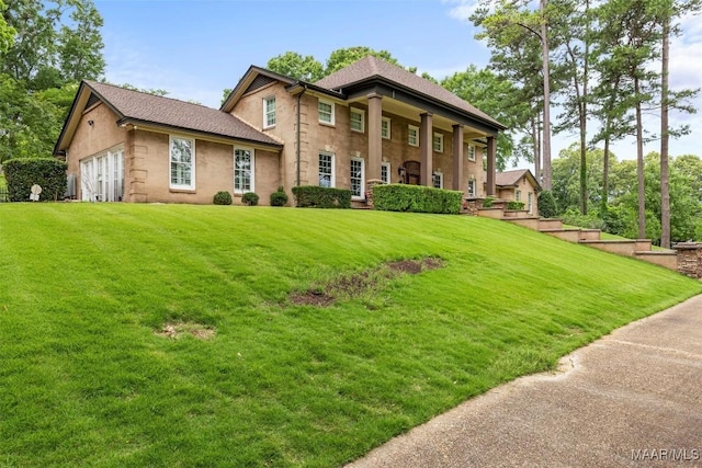 161 Watson Cir, Montgomery, AL 36109 - greek revival house featuring a front lawn and stucco siding