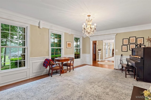 161 Watson Cir, Montgomery, AL 36109 - sitting room with a chandelier, ornamental molding, wood finished floors, wainscoting, and a decorative wall