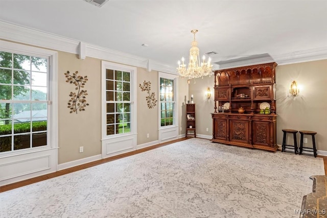 161 Watson Cir, Montgomery, AL 36109 - unfurnished room with a chandelier, healthy amount of natural light, crown molding, and baseboards