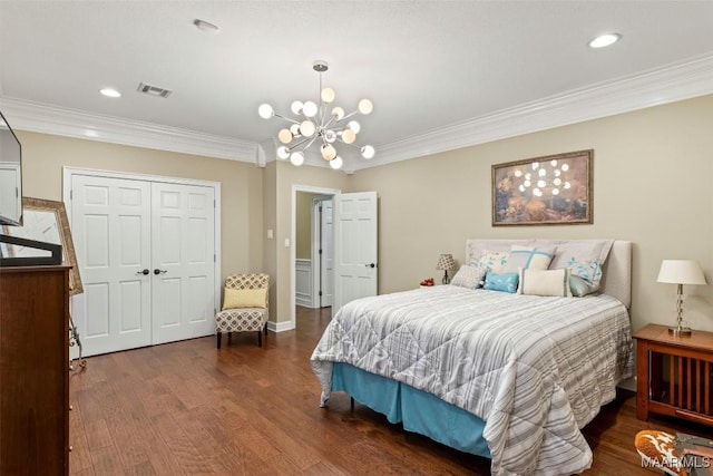 161 Watson Cir, Montgomery, AL 36109 - bedroom with dark wood-style floors, ornamental molding, a closet, a chandelier, and recessed lighting