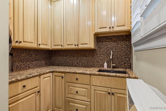 161 Watson Cir, Montgomery, AL 36109 - kitchen with a sink, tasteful backsplash, light stone countertops, and light brown cabinetry