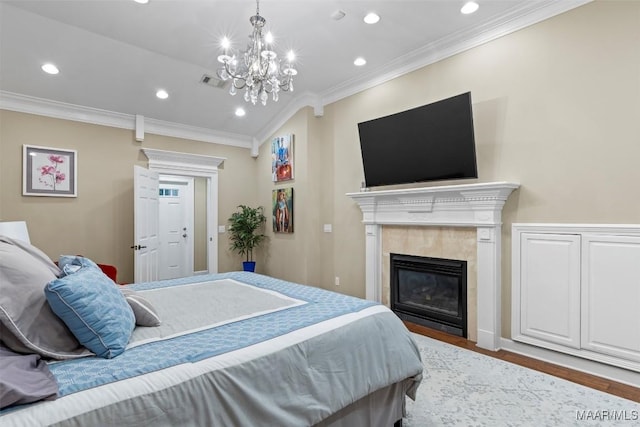 161 Watson Cir, Montgomery, AL 36109 - bedroom with crown molding, wood finished floors, recessed lighting, a fireplace, and a chandelier