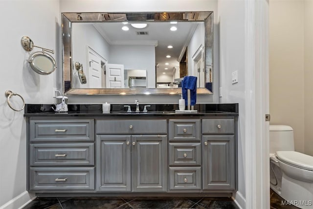 161 Watson Cir, Montgomery, AL 36109 - bathroom with vanity, toilet, baseboards, and crown molding