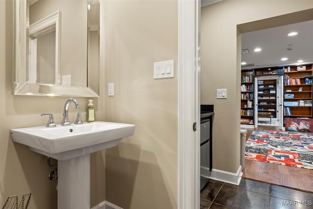 161 Watson Cir, Montgomery, AL 36109 - bathroom with baseboards, recessed lighting, and a sink