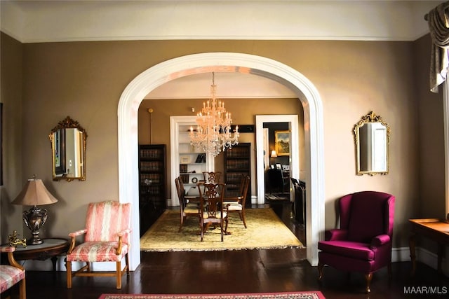 402 S Perry St, Montgomery, AL 36104 - dining area featuring arched walkways, a chandelier, wood finished floors, and ornamental molding