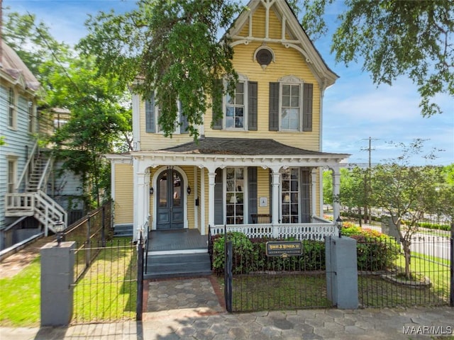 402 S Perry St, Montgomery, AL 36104 - view of front of house featuring a porch, a fenced front yard, and a gate