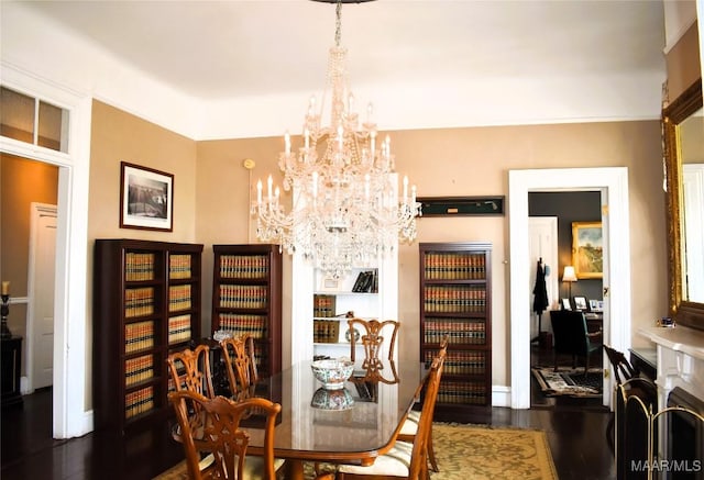402 S Perry St, Montgomery, AL 36104 - dining space with a chandelier, wood finished floors, and baseboards