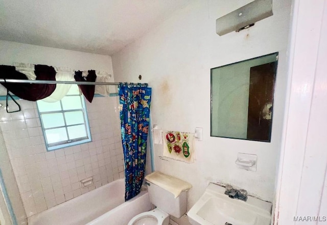 519 Woodbrook Dr, Montgomery, AL 36110 - bathroom featuring toilet, shower / bathtub combination with curtain, and a sink