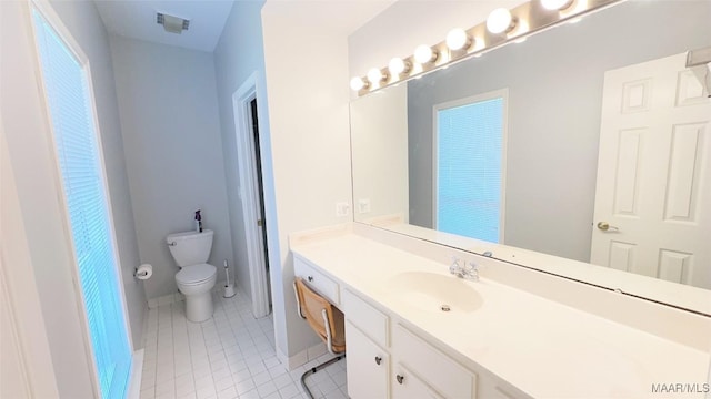 1571 Meriwether Cir, Montgomery, AL 36117 - bathroom with vanity, tile patterned flooring, toilet, and baseboards