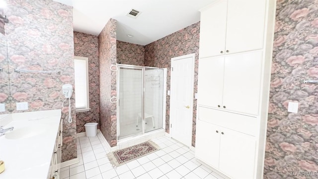 1571 Meriwether Cir, Montgomery, AL 36117 - full bathroom featuring vanity, tile patterned flooring, a shower stall, toilet, and wallpapered walls