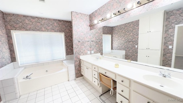 1571 Meriwether Cir, Montgomery, AL 36117 - full bath featuring tile patterned flooring, a garden tub, double vanity, and wallpapered walls