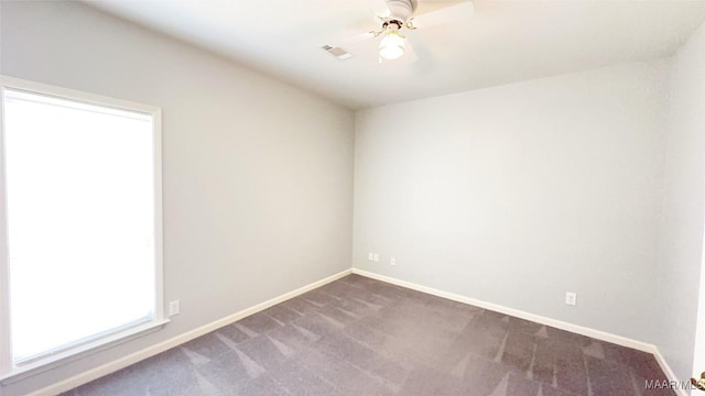 1571 Meriwether Cir, Montgomery, AL 36117 - spare room featuring dark colored carpet, baseboards, and ceiling fan