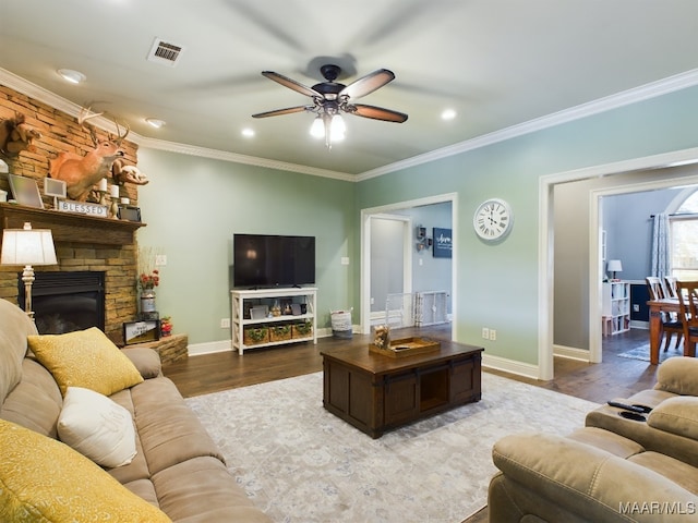 661 Blackberry Rd, Deatsville, AL 36022 - living area with a ceiling fan, wood finished floors, a fireplace, ornamental molding, and baseboards