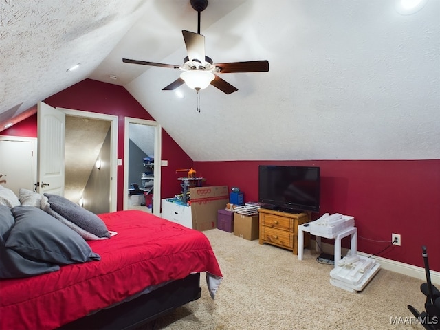 661 Blackberry Rd, Deatsville, AL 36022 - bedroom featuring vaulted ceiling, carpet, a ceiling fan, a textured ceiling, and baseboards