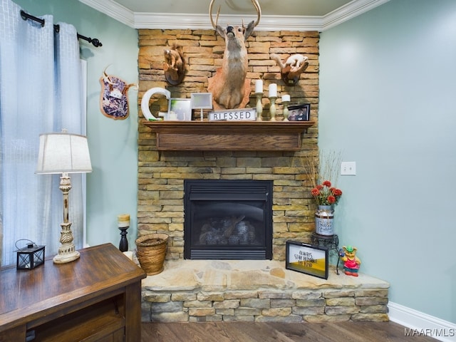 661 Blackberry Rd, Deatsville, AL 36022 - detailed view of wood finished floors, crown molding, baseboards, and a stone fireplace
