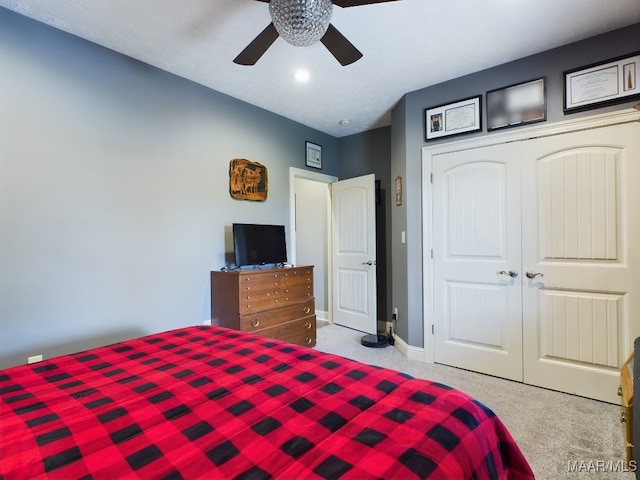 661 Blackberry Rd, Deatsville, AL 36022 - carpeted bedroom featuring a closet, a ceiling fan, and baseboards