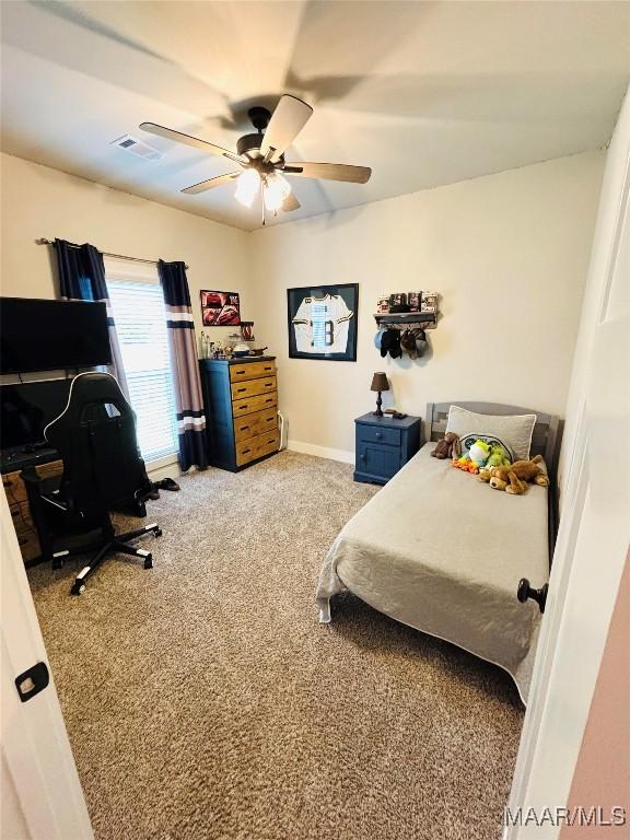 1670 Rifle Range Rd, Wetumpka, AL 36093 - carpeted bedroom with an office area, ceiling fan, and baseboards