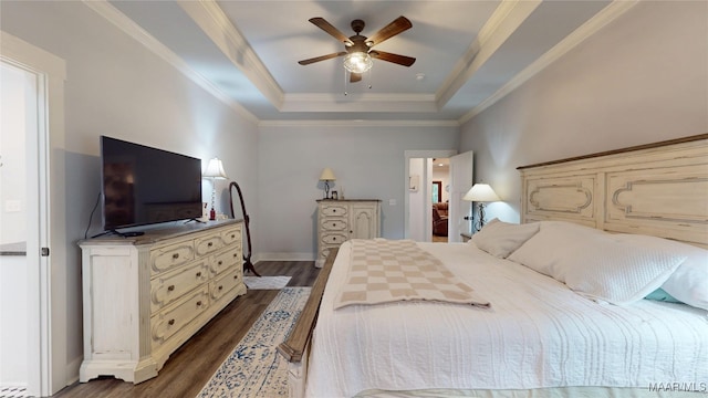 3063 Little Rd, Tallassee, AL 36078 - bedroom with a tray ceiling, dark wood finished floors, ornamental molding, baseboards, and ceiling fan