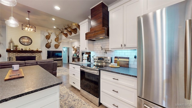 3063 Little Rd, Tallassee, AL 36078 - kitchen featuring stainless steel appliances, recessed lighting, premium range hood, backsplash, and white cabinets
