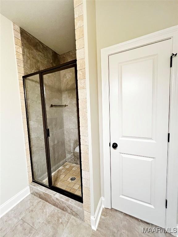 475 Mountain Meadows Ln, Wetumpka, AL 36093 - full bathroom with a stall shower and baseboards