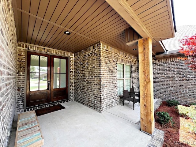 475 Mountain Meadows Ln, Wetumpka, AL 36093 - entrance to property featuring french doors, brick siding, and a patio